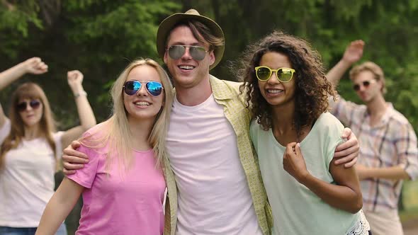 Summer Party Atmosphere, Cheerful Young Guys Hugging With Happy Smiles on Faces