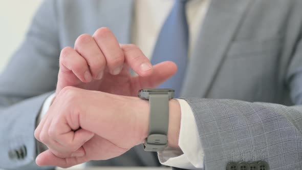 Hands Close Up of Businessman Using Smart Watch