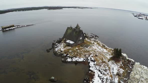 Flying over the township on coast in winter