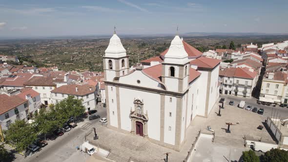 Aerial orbit over mother church of Castelo de Vide and Dom Pedro V square - Portugal