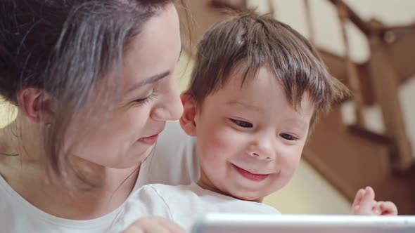 Watching Cartoons on Tablet with Kid alt