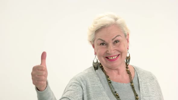Elderly Woman Showing Thumbs Up