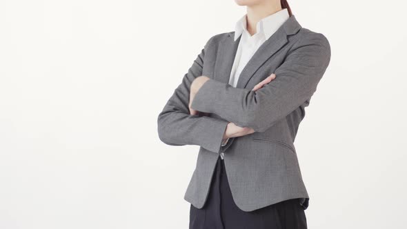 Businesswoman with Crossed Arms on Chest