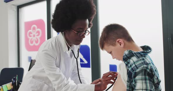 Beautiful Doctor Listens To The Heartbeat Of The Child