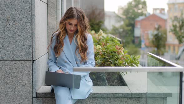 Caucasian Business Woman Young Girl Typing on Laptop Keyboard Sitting on Roof Terrace in City