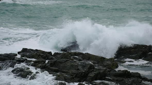 Ocean Waves Crashing On Rocks In Slow Motion. Locked Off