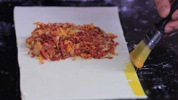 A Professional Chef Pouring Raw Egg Yolk 