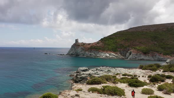 Aerial View of White Rocky Coast with Old Ancient Stone Tower Lighthouse Building