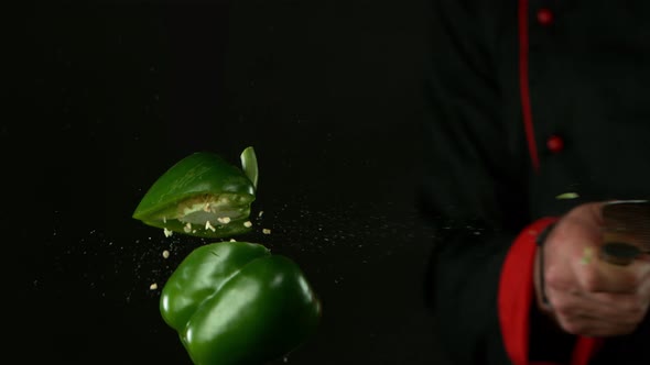 Super Slow Motion Shot of Chef Chopping Green Pepper in the Air at 1000 Fps