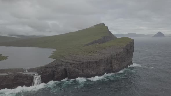 Aerial Drone Footage of Bosdalafossur waterfall, Sorvagsvatn and Traelanipan,Vagar, Faroe Islands