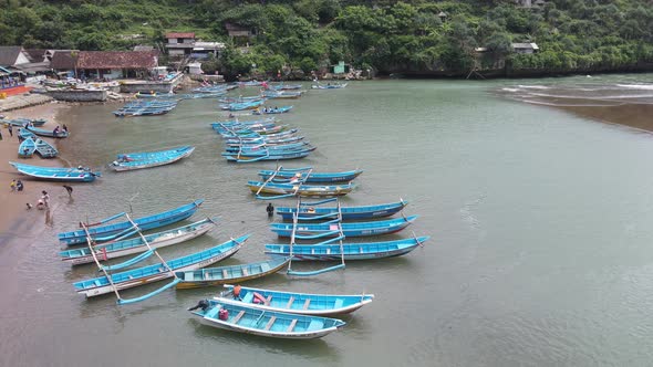 Aerial view of traditional boats in lagoon beach in Indonesia