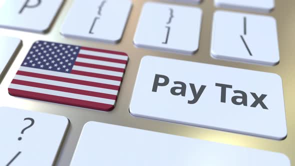 PAY TAX Text and Flag of the United States on the Keyboard
