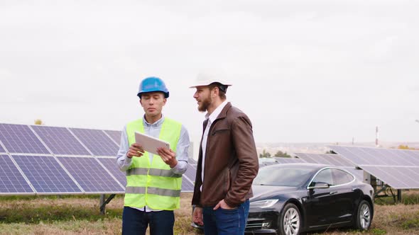 Multiracial Two Ecological Engineers Talking