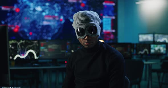 Black Hacker Looking at Camera