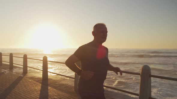 Senior man running on the promenade