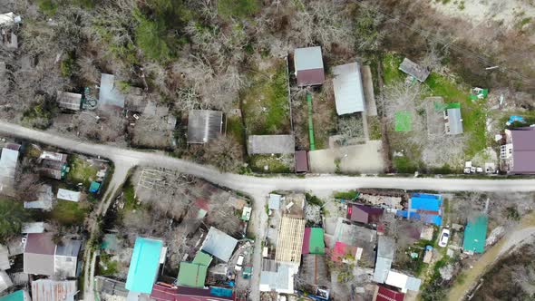 Flying over the village. Flying over the village in the mountains.