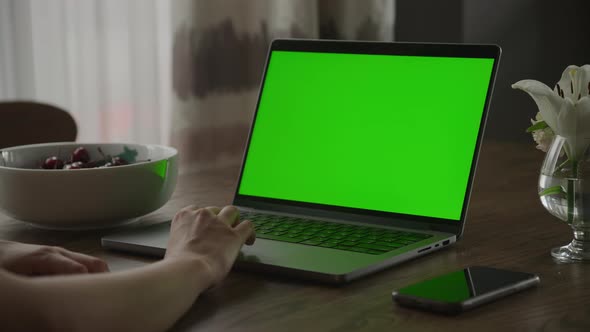 Close Up of a Caucasian Woman Hand Rest on a Laptop Computer Touchpad with Green Screen Chroma Key