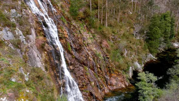 waterfall on the Sor River by the rocky cliff surrounded by forests with freshwater fishing area. Dr