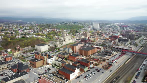 Aerial drone flying over small, rural downtown of Altoona Pennsylvania in the summer showcasing the