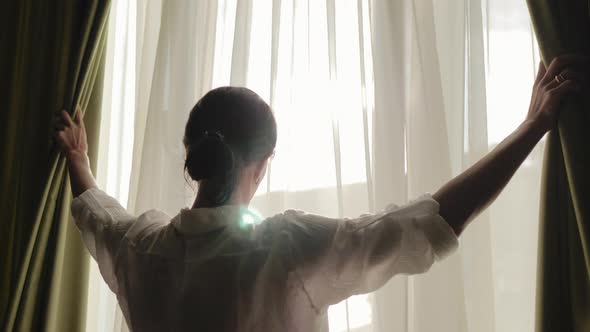 Lovely Girl is Awake and Standing Before Window