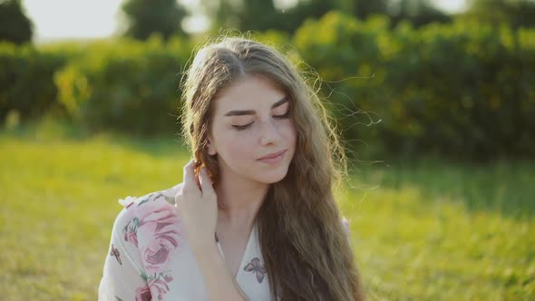 Portrait of Beautiful Longhaired Lady on Sunny Summer Nature