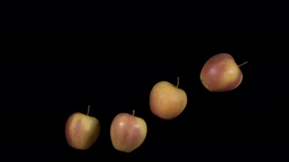 Flying Apples on a Black Background