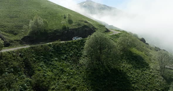 Tskhratskaro Pass With Car Driving During Foggy Day In Samtskhe-Javakheti, Georgia. Aerial Drone Sho