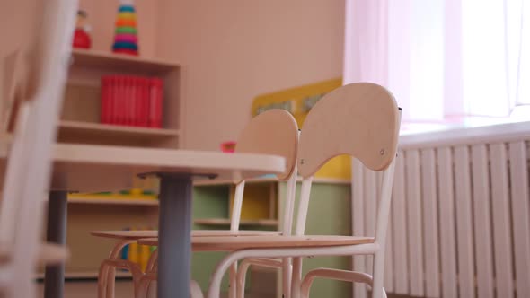 Wooden Table with Small Chairs in Classroom of Kindergarten alt