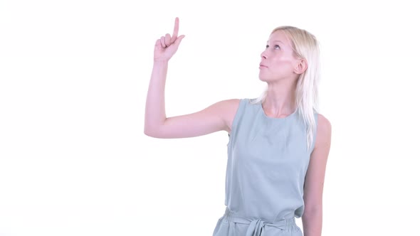 Stressed Young Blonde Woman Thinking and Pointing Up