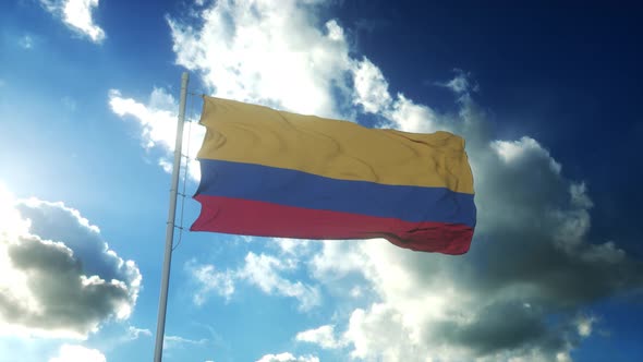 Flag of Colombia Waving at Wind Against Beautiful Blue Sky