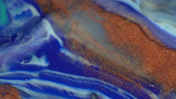 Blue, white, gold and metallic copper colors oil paint pouring. Fluid Art painting