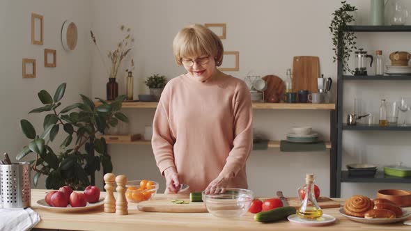 Senior Woman Cooking and Telling Recipe on Camera