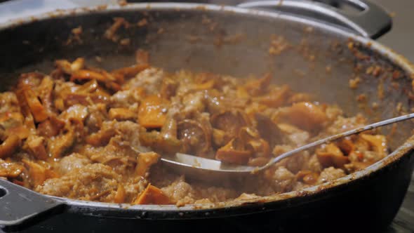 Beef and Mushrooms Chanterelles Cooking on Street Food Market Spain Barcelona