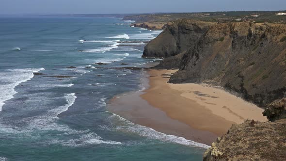 Sandy Beach and Cliff Rocks on Atlantic Coast