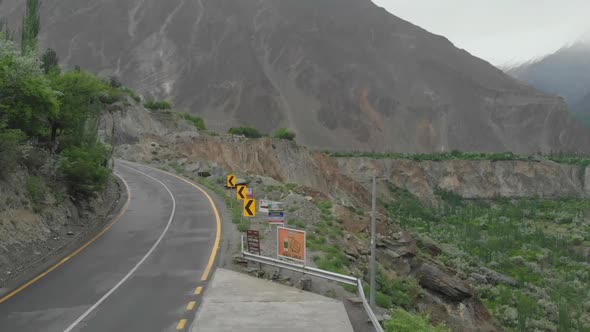 Empty Winding Mountain Road At Gilgit With Mountain Background. Pedestal Up