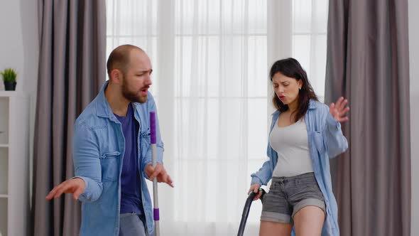 Couple Dancing While Cleaning