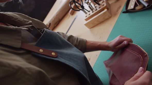 Female Currier Finishing Making Leather Bag