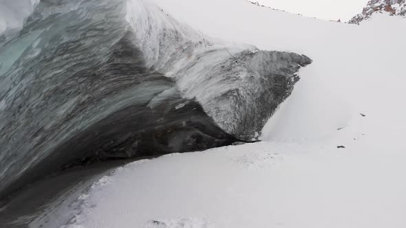 Aerial Shot of Winter Glacier Ice Wall in the Mountains