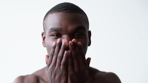 Man Skincare Face Moisturizing Happy African Guy