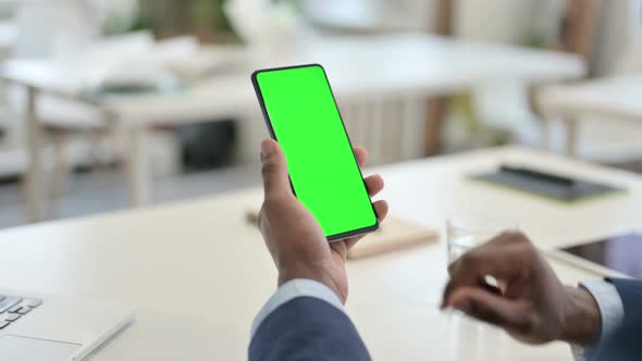 Businessman Using Smartphone with Green Chroma Key Screen