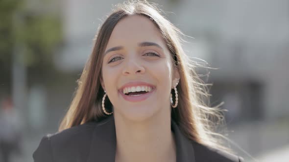 Attractive Young Woman Smiling at Camera