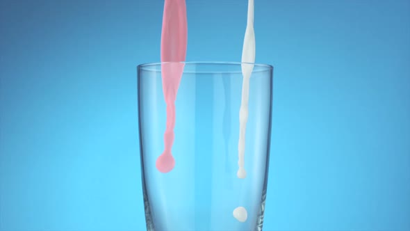 Milk and strawberry milk pouring into glass, Slow Motion