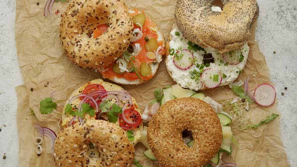 Tasty Colorful Various Bagels with Healthy Ingredients Served on Brown Baking Paper