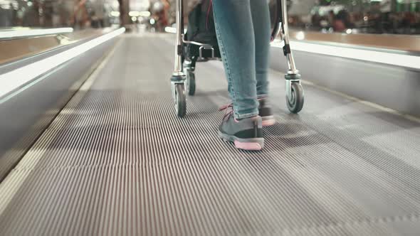 Woman with Luggage Truck Walk at Airport Terminal