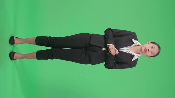 Full Body Of Asian Businesswoman Standing And Presenting Something On The Green Screen