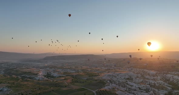 Aerial Cinematic Drone View of Colorful Hot Air Balloon Flying Over Cappadocia