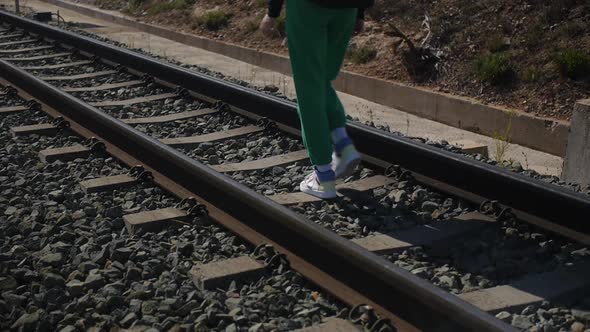 a Teenager on the Railway Tracks