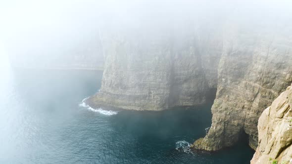 Beautiful View of Foggy Traelanipan Slave Mountain in Vagar Faroe Islands