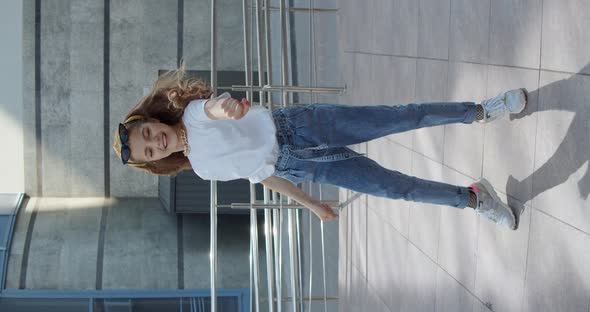 Joyful Stylish Girl Dancing Hiphop and Having Fun Front Camera on Urban Area