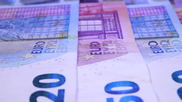 Euro bills with the light of a police flasher